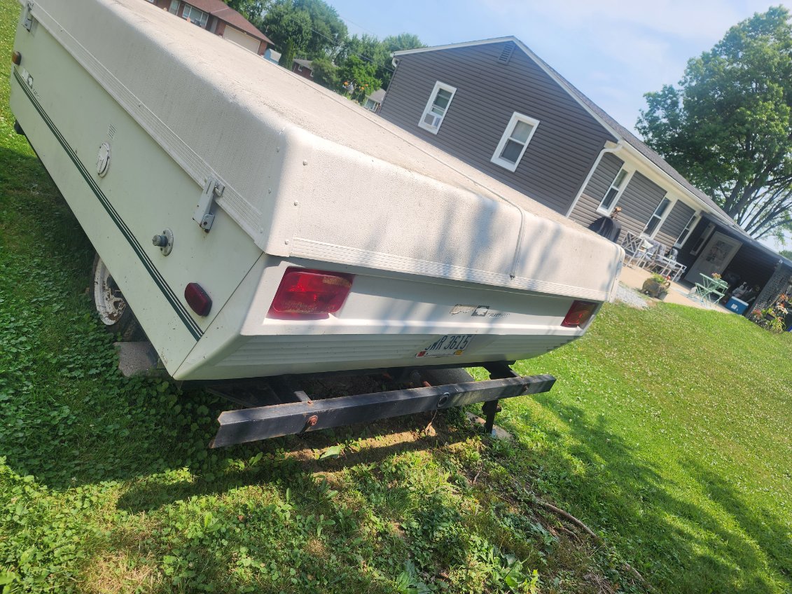 The tires are flat and dry-rotted, and the canvas has been damaged by mice. The camper has had all personal items cleaned out, and I have a clear title.