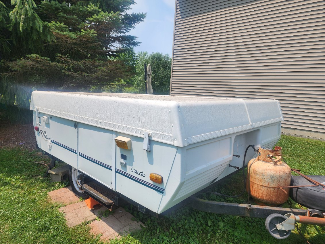 The tires are flat and dry-rotted, and the canvas has been damaged by mice. The camper has had all personal items cleaned out, and I have a clear title.