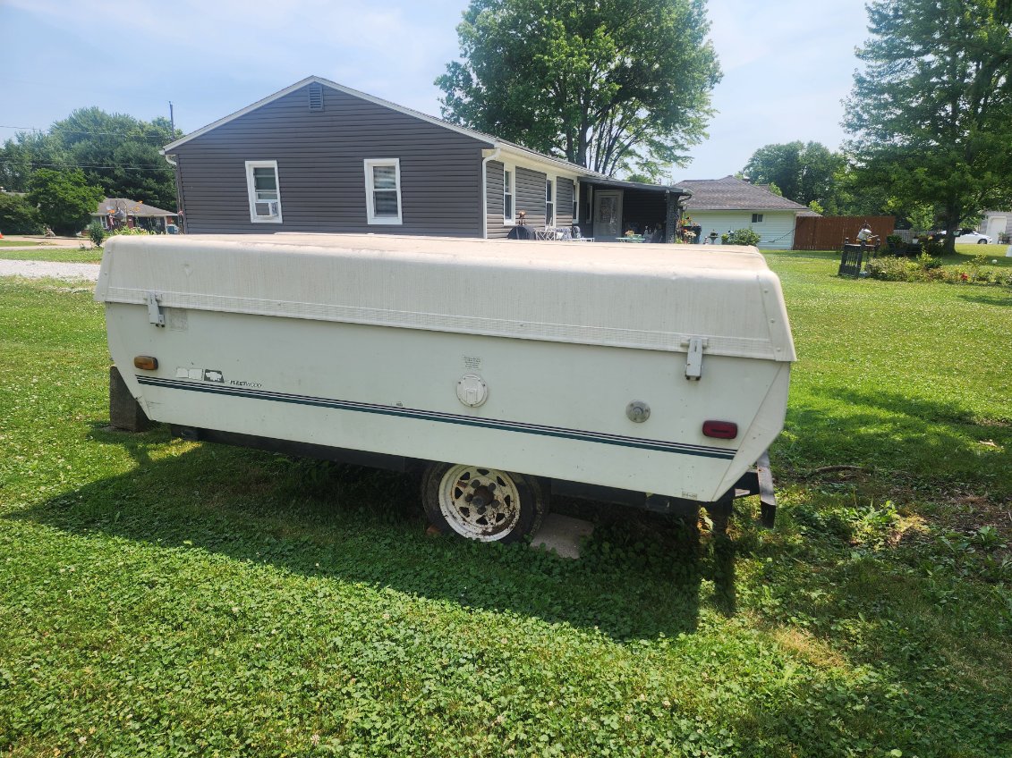 The tires are flat and dry-rotted, and the canvas has been damaged by mice. The camper has had all personal items cleaned out, and I have a clear title.