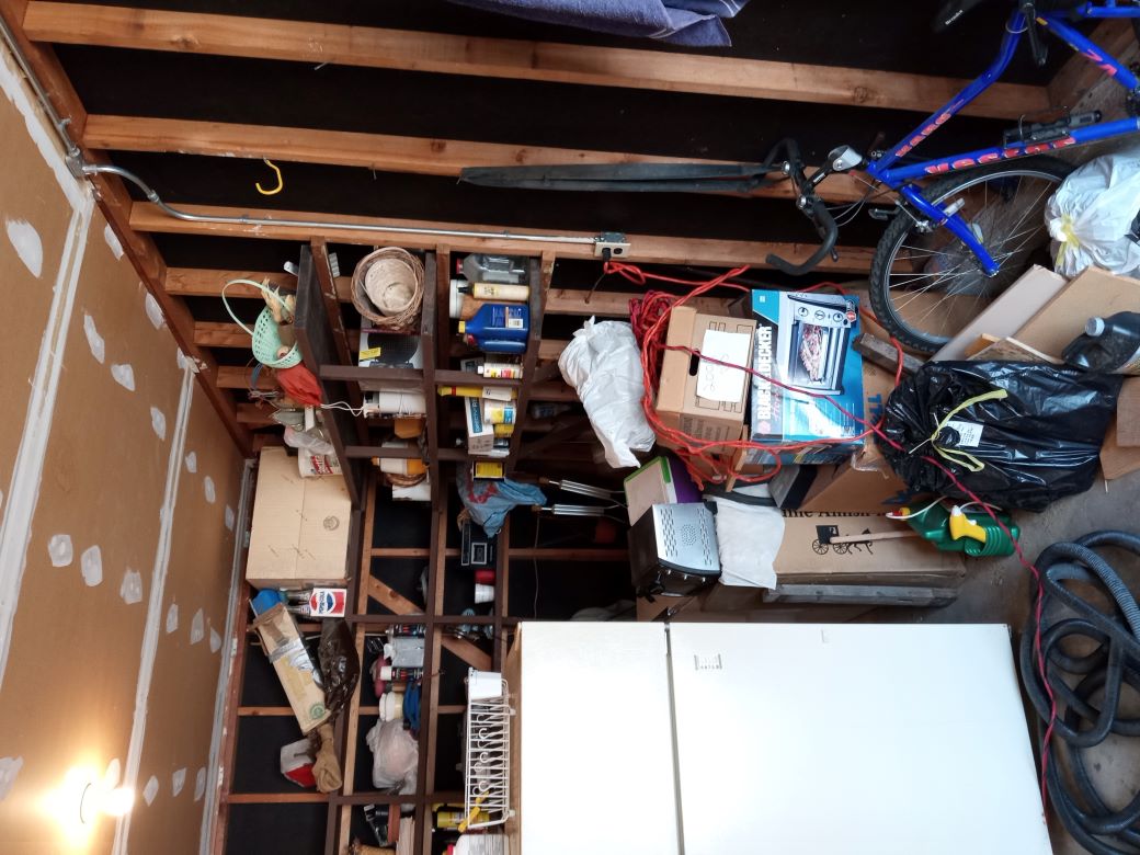 Freezer removal containing 30 gallons of water with bad food. Several garbage bags of bad frozen food.
Yard debris. Garage junk. Magazines, empty boxes, paper bags.