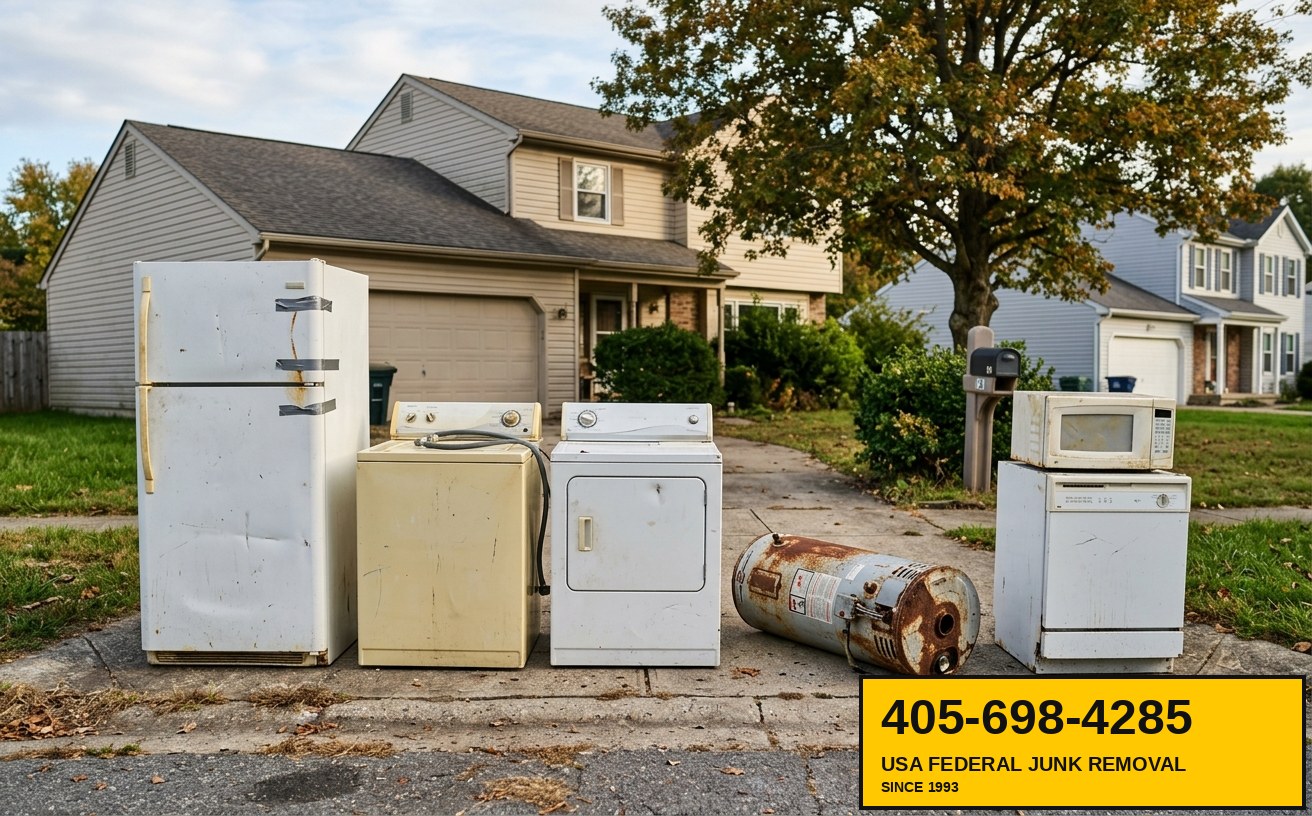 Old appliances — refrigerator, washer, dryer, water heater — lined up at driveway for appliance removal
