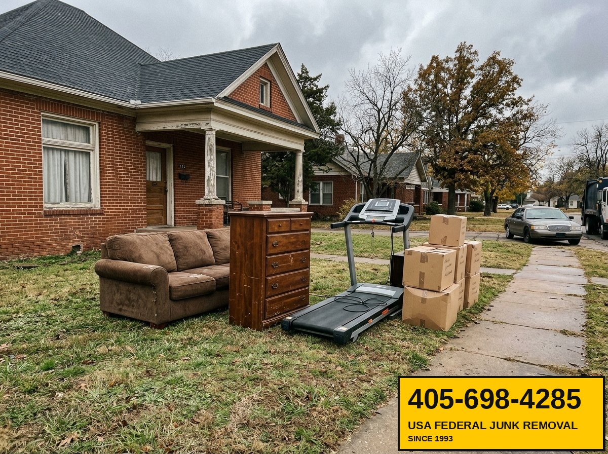 Estate cleanout staging — furniture and household items on lawn ready for haul-off